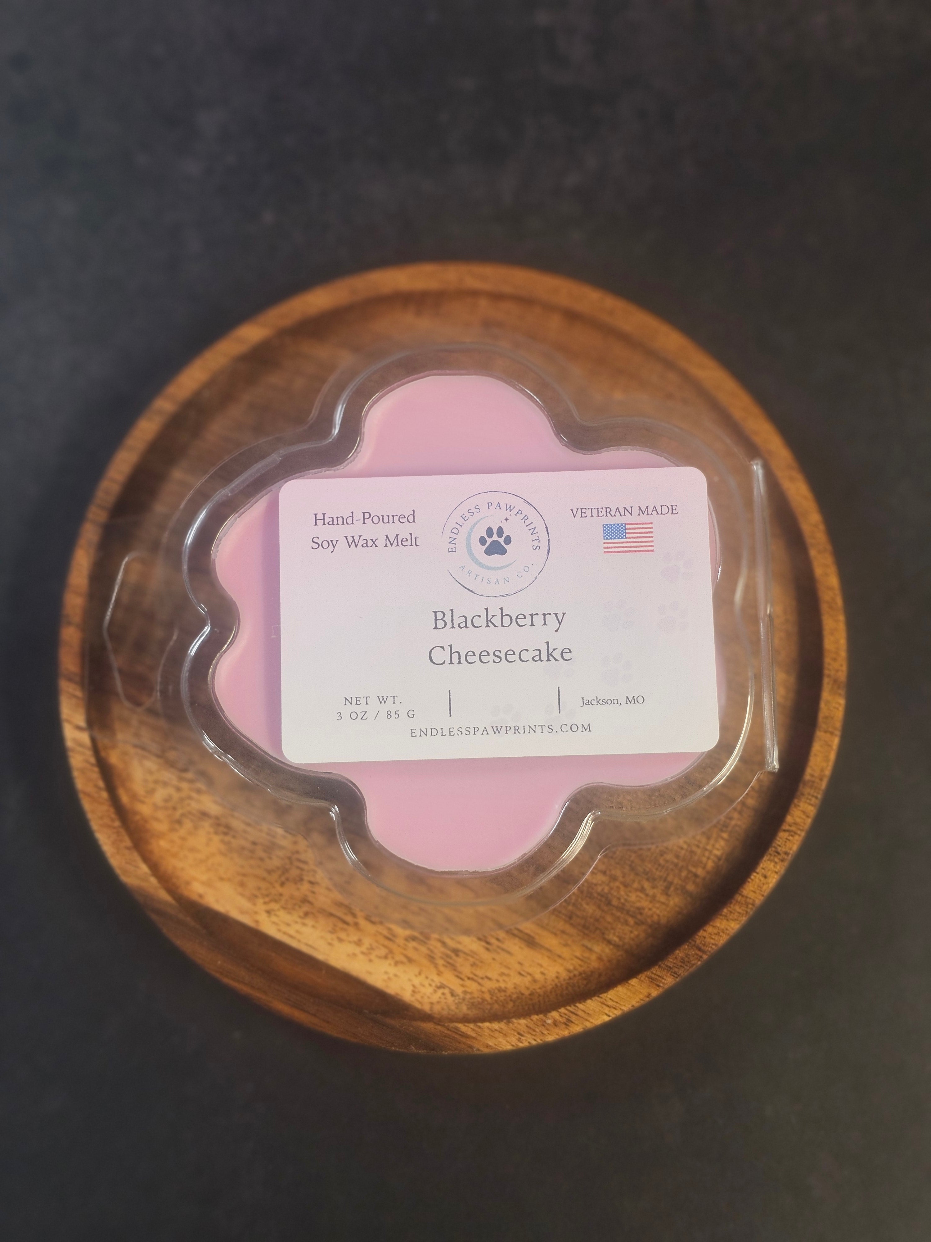 Blackberry cheeseckae wax melt in a pawprint clam shell