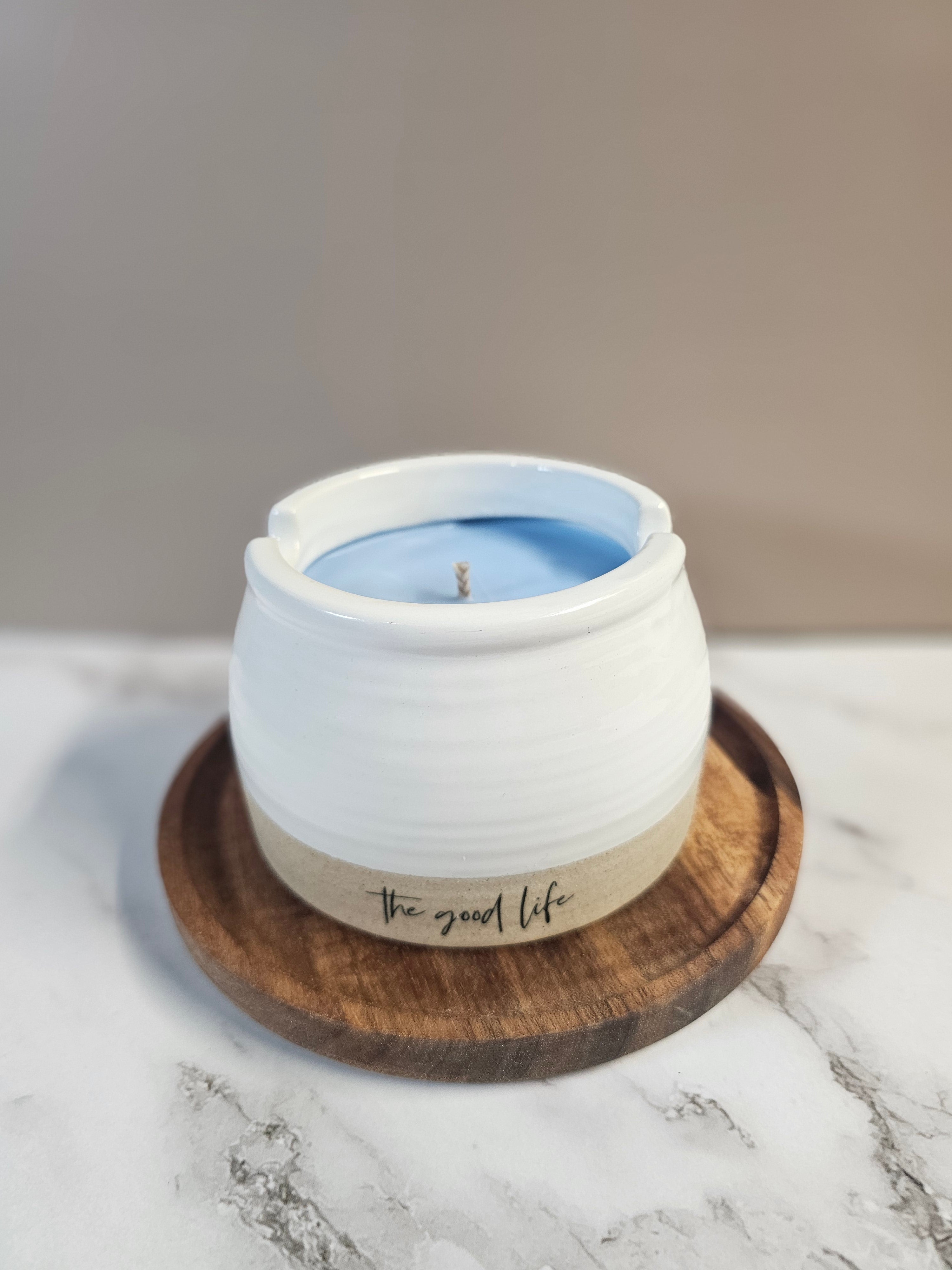 White ceramic candle filled with blueberry mornings