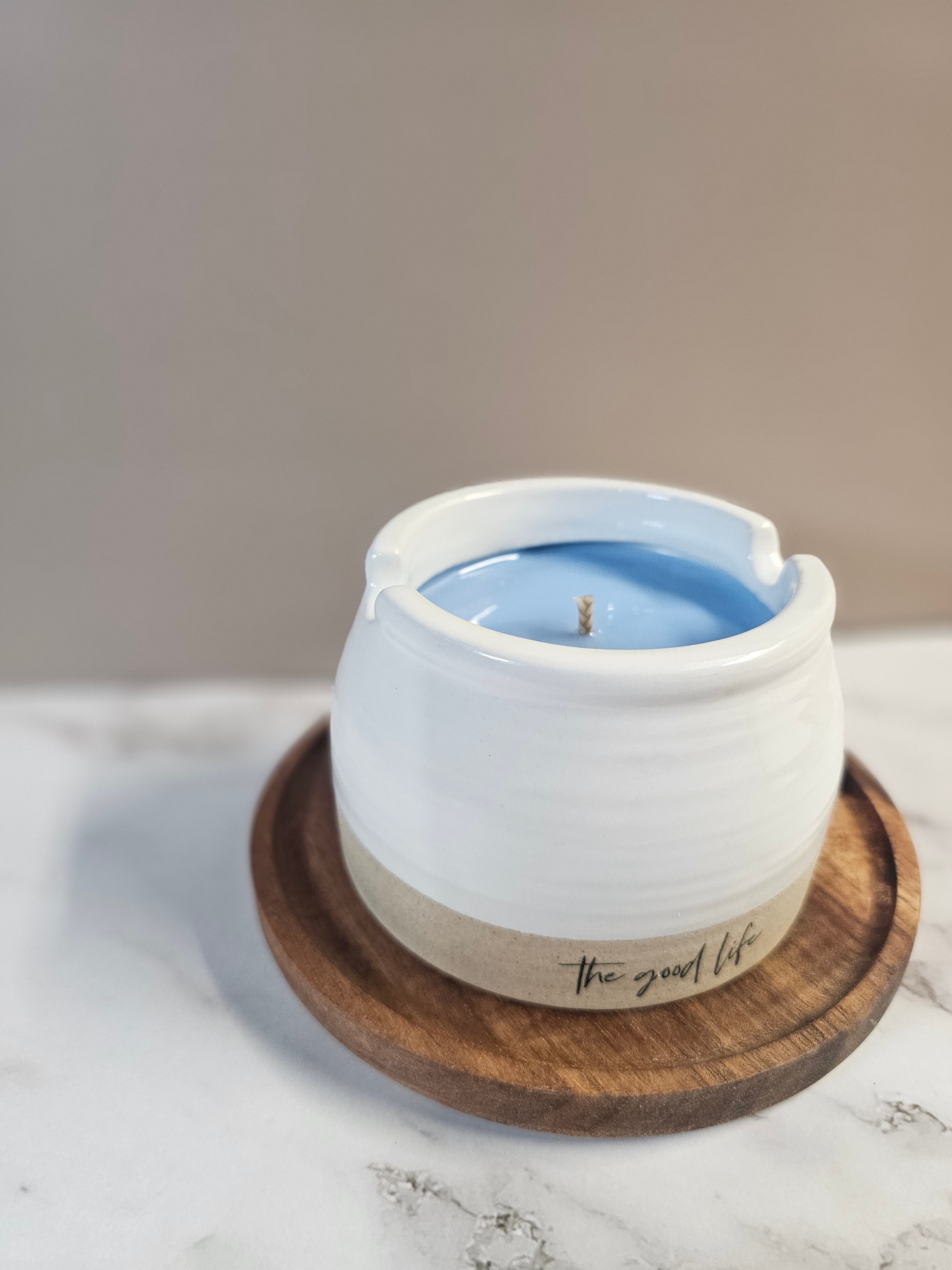 White ceramic container filled with blue berry mornings.