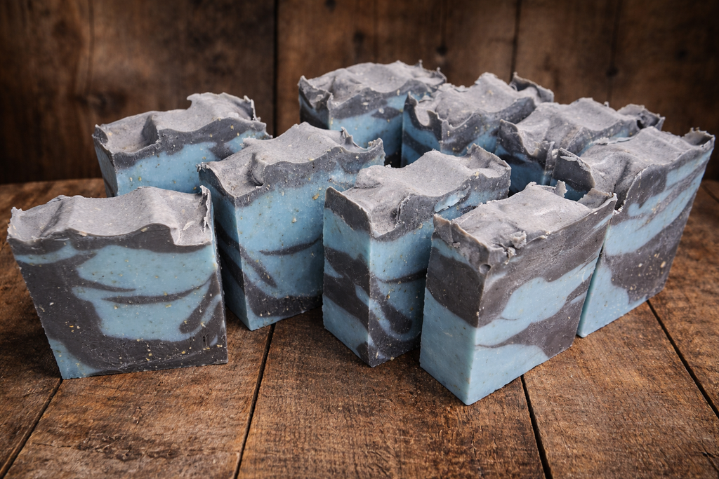 Multiple oceans relief bars of soap with a wooden background