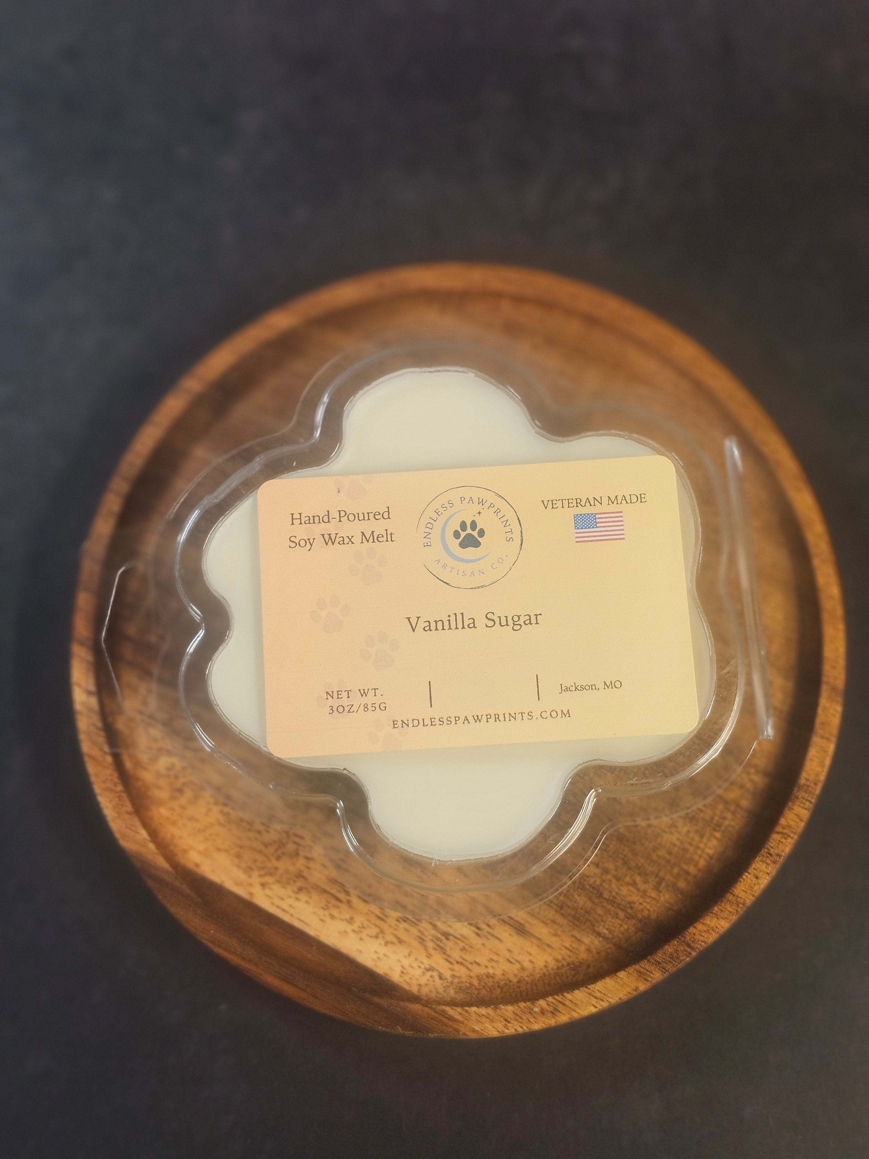 Vanilla sugar wax melt in a paw print clam shell